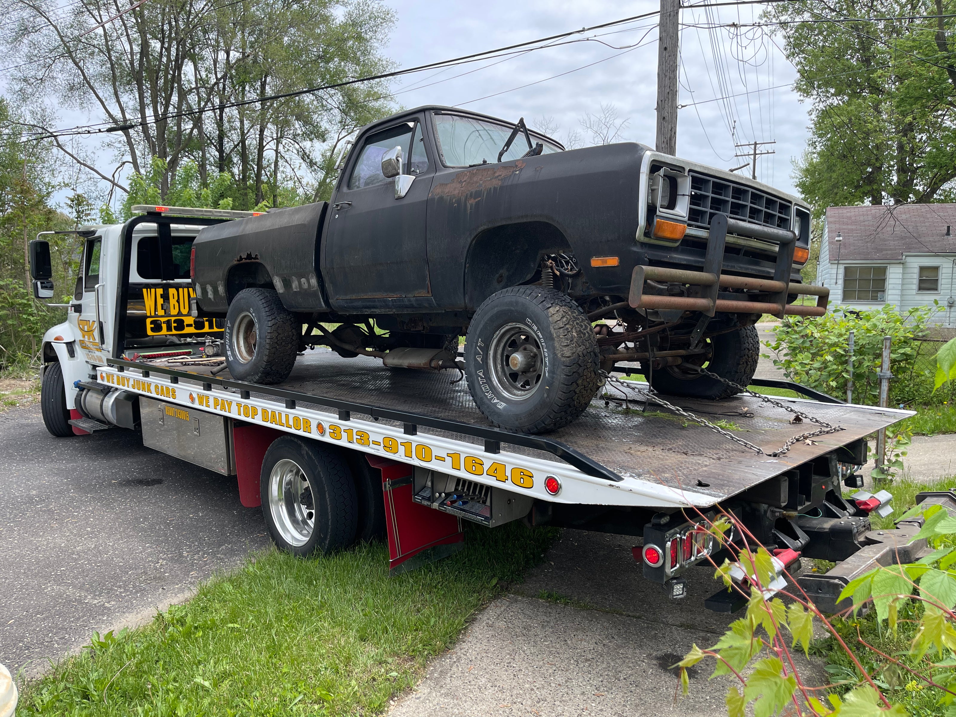 Black car on pick up truck