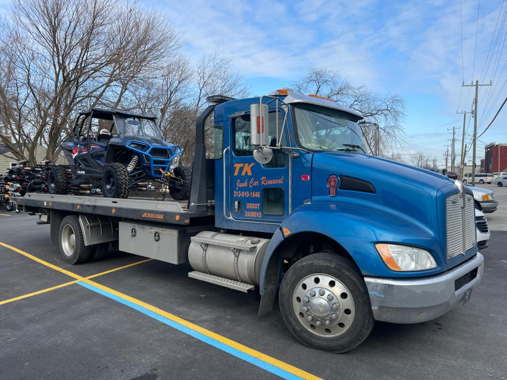 TK blue junk car towing truck