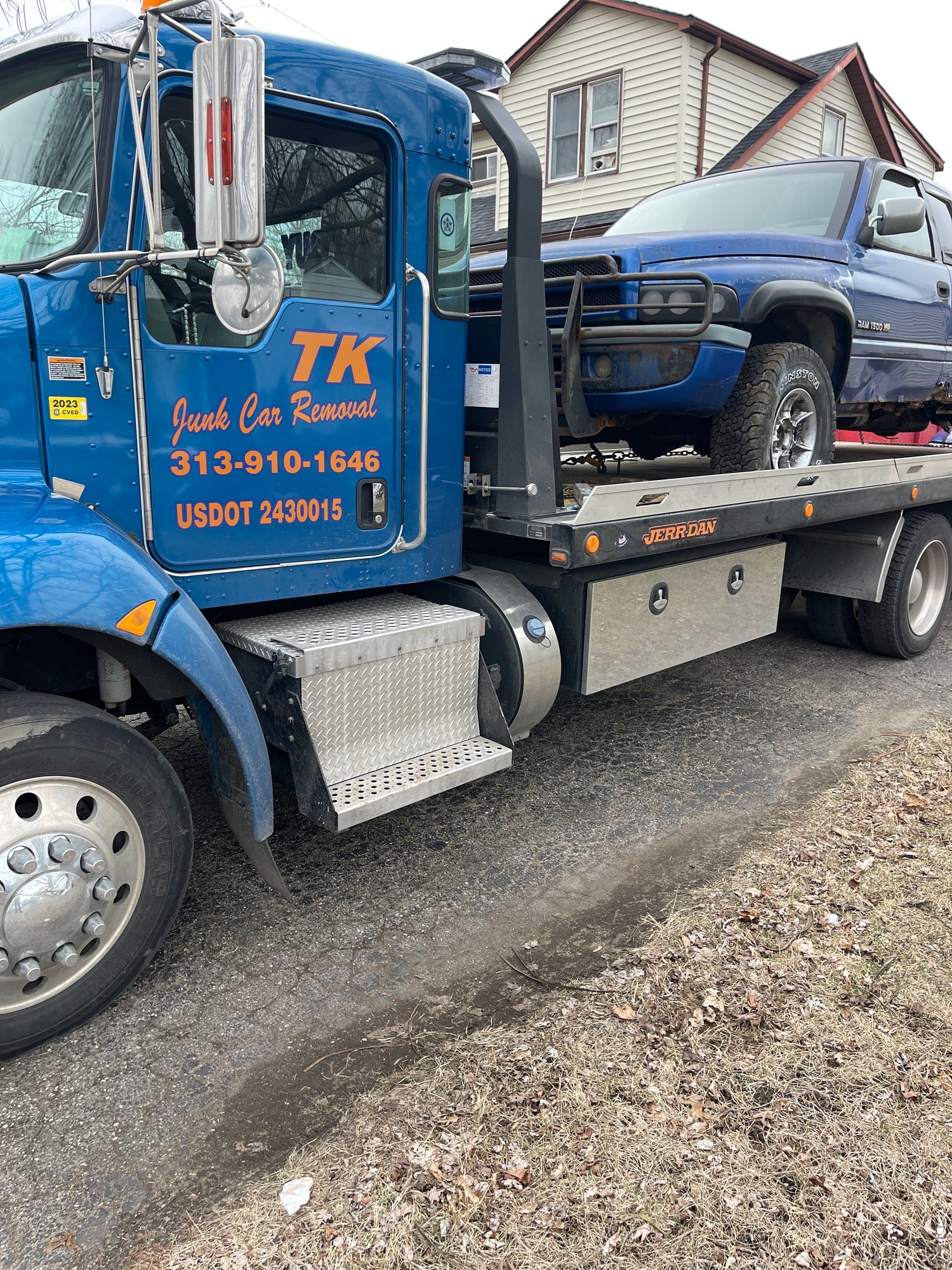 T.K. Cash For Junk Cars Blue Towing Truck